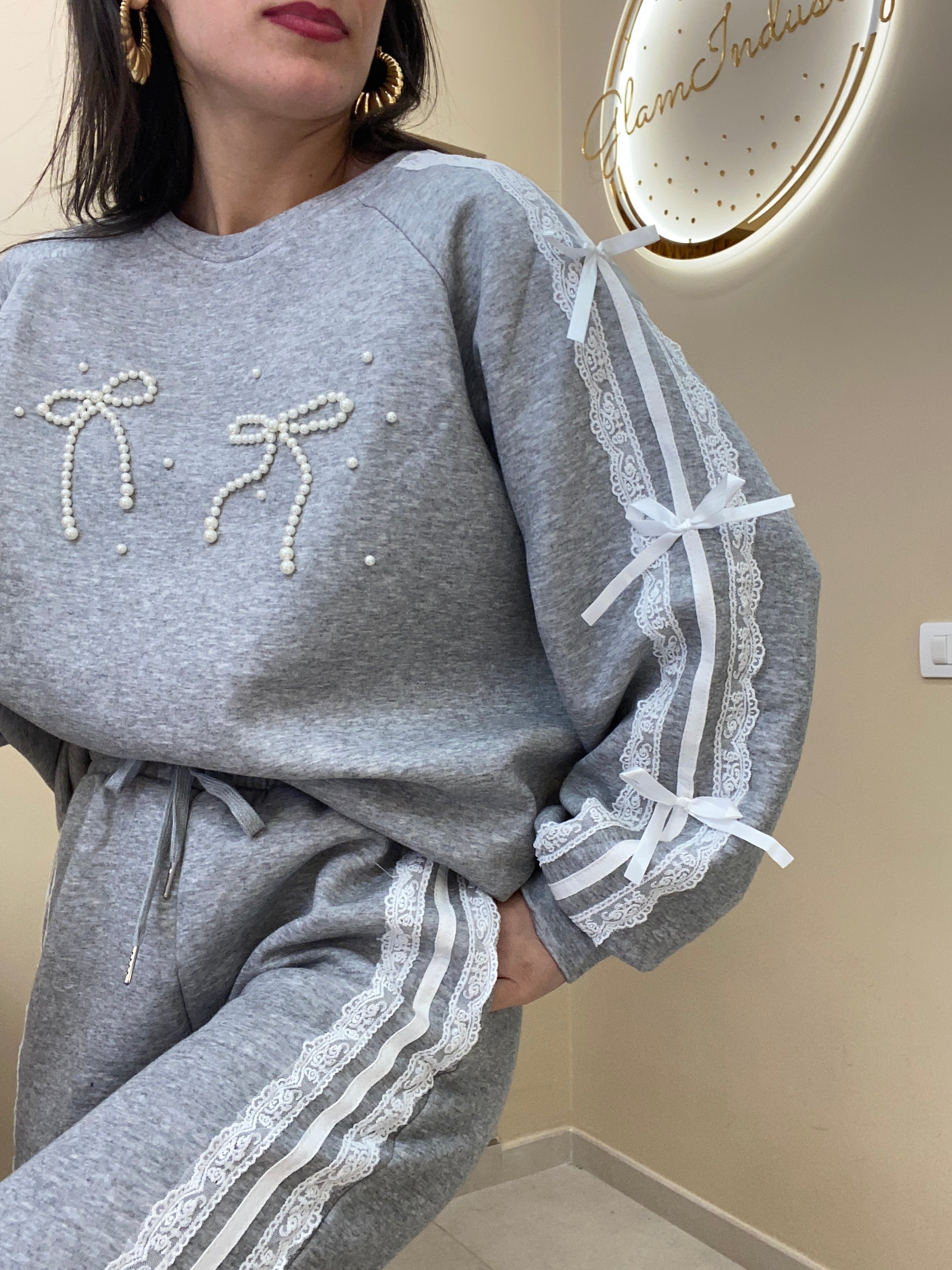 Tuta doppio fiocco con perle