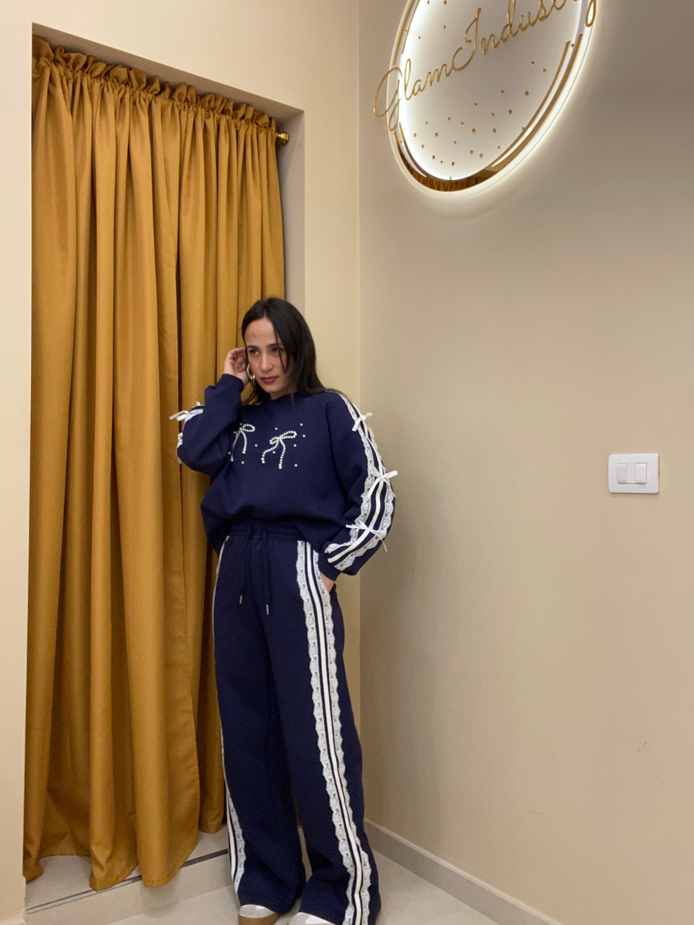 Tuta doppio fiocco con perle