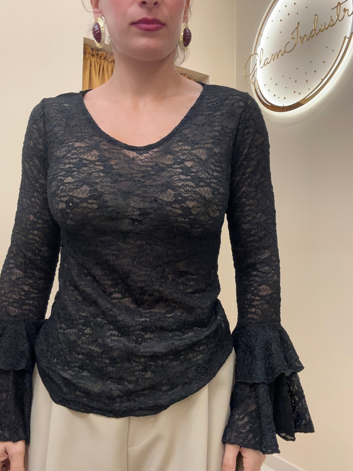 Blusa merletto con manica ampia