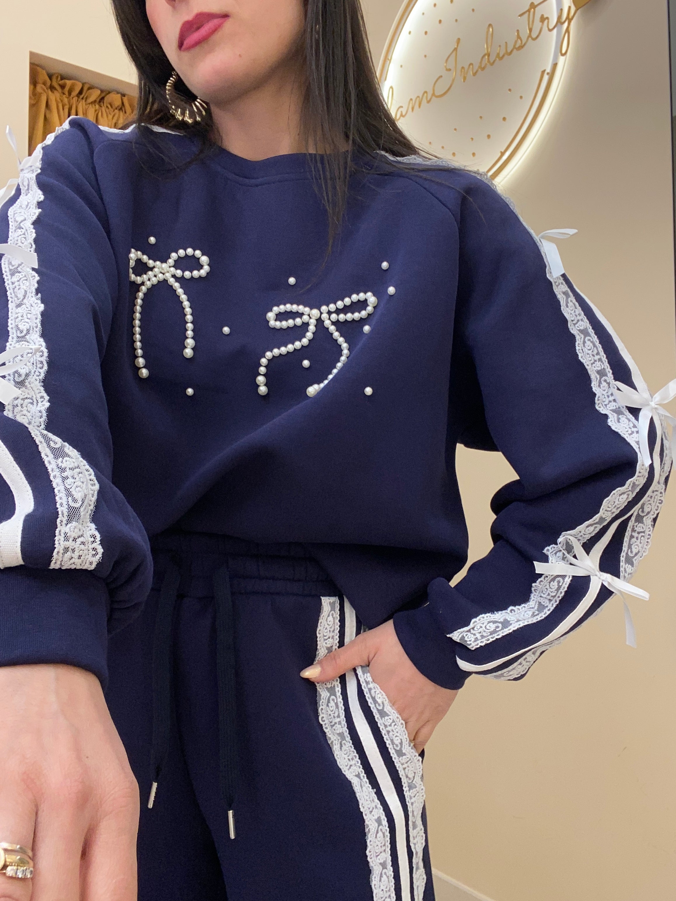 Tuta doppio fiocco con perle