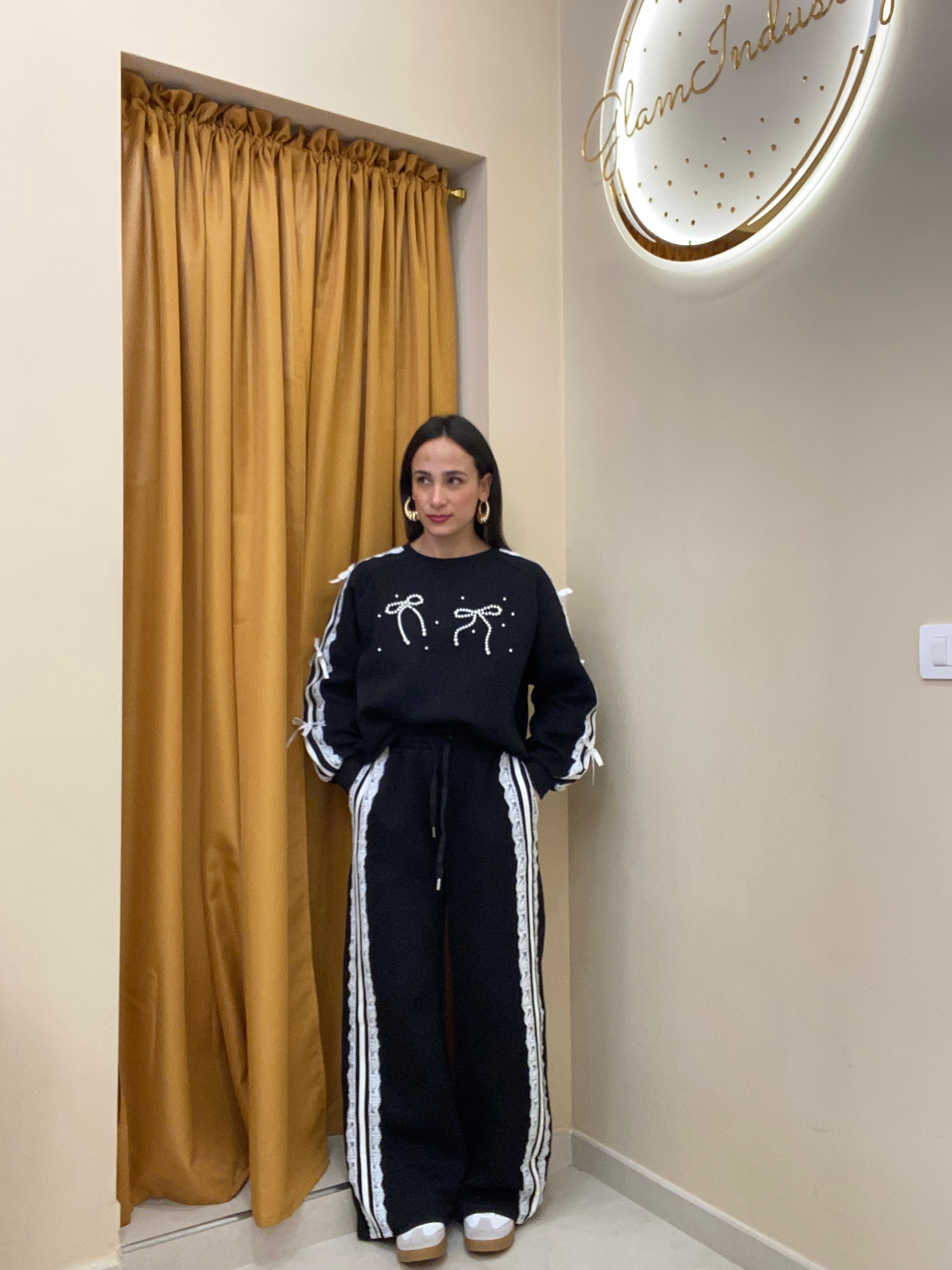 Tuta doppio fiocco con perle