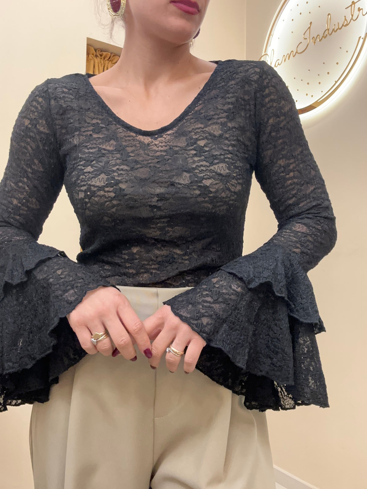 Blusa merletto con manica ampia