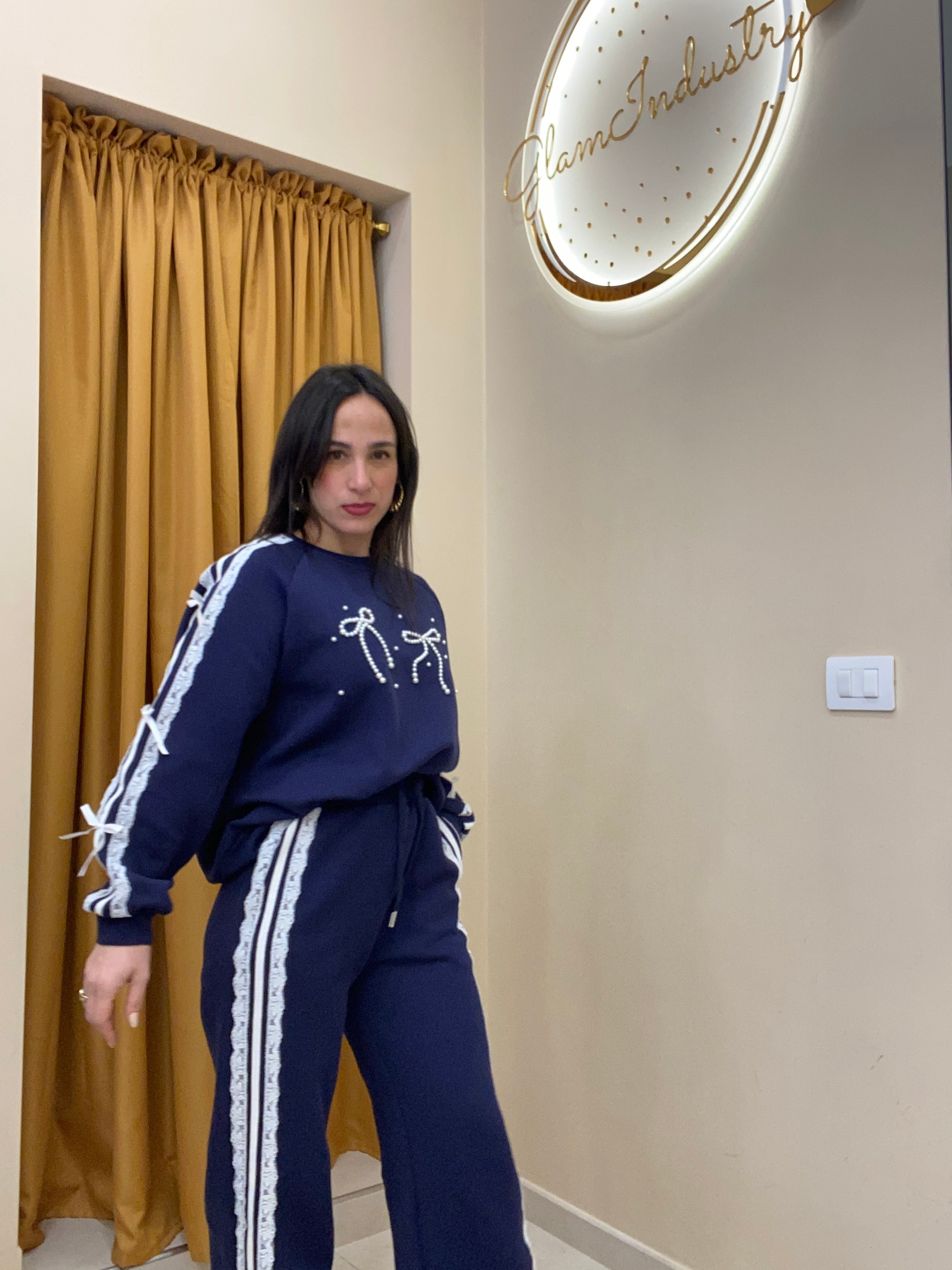 Tuta doppio fiocco con perle